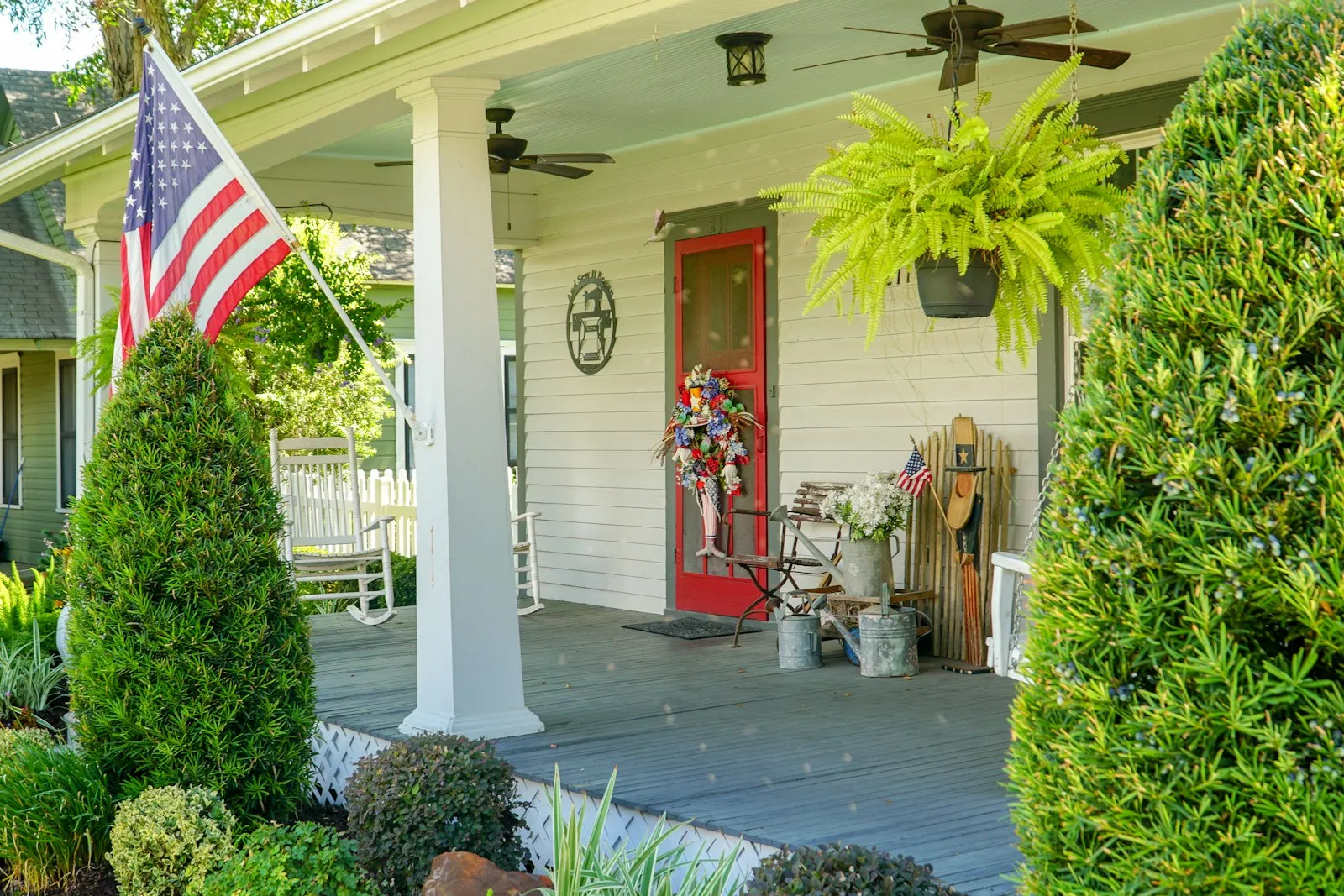 Front porch of a Kentucky home with an American flag